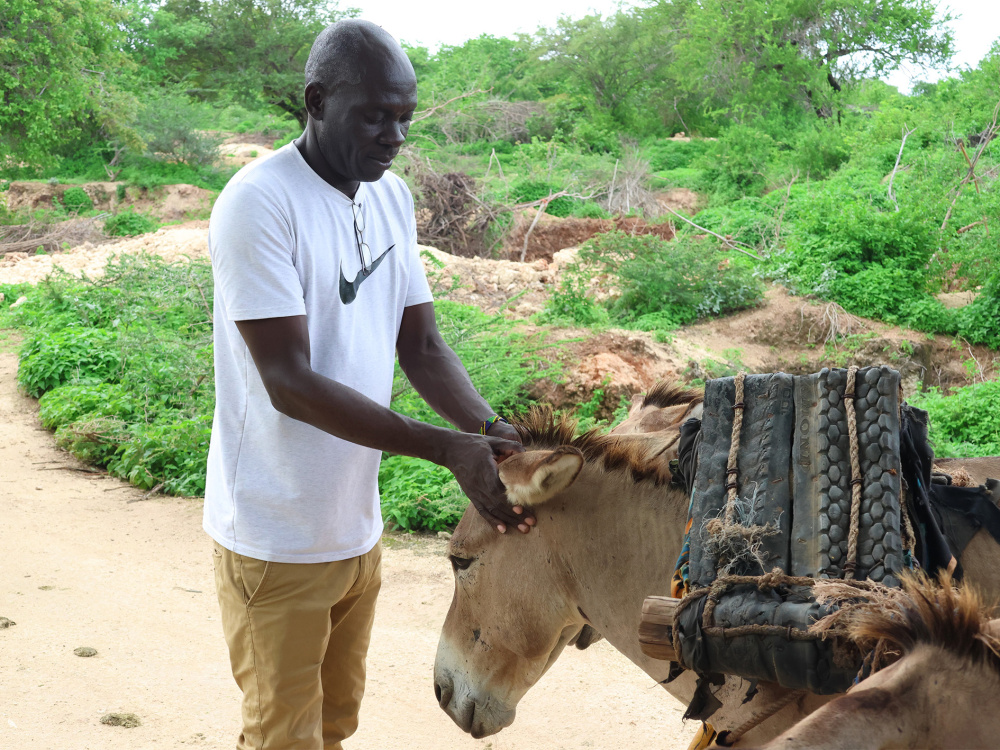 Bernard Owuor with a donkey near the quarry on Mandu Island